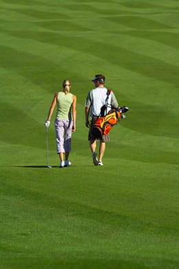 A couple golfing together